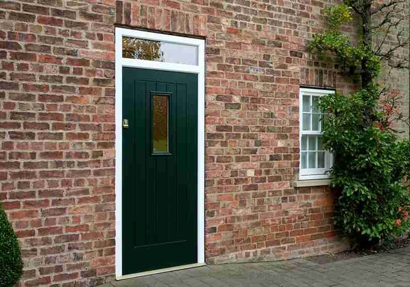 A black composite front door for a home in Dorset.