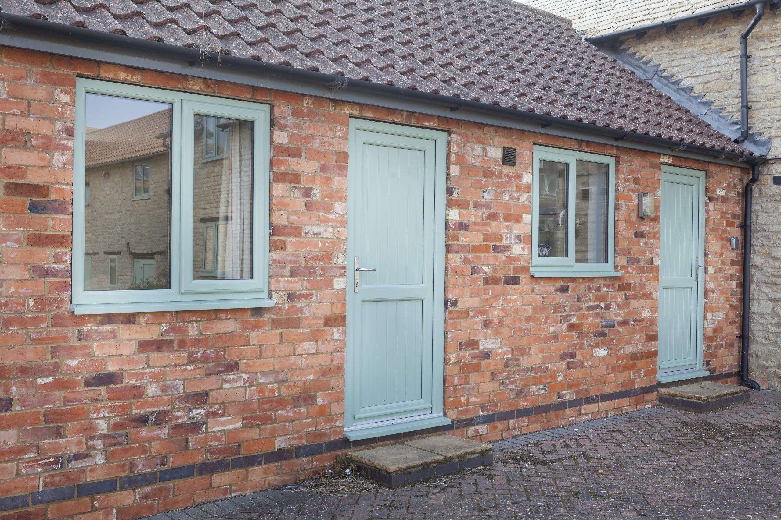 bespoke light green door and windows