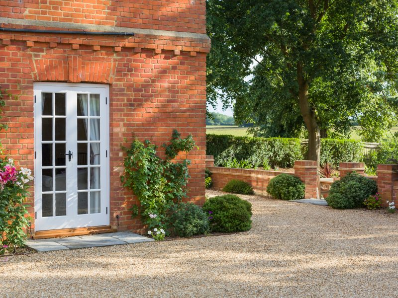 A white back door in Dorset.