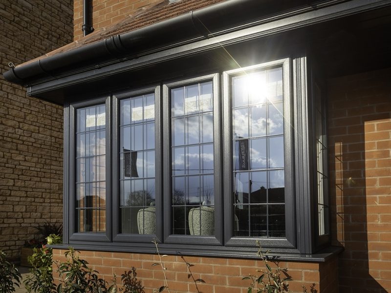 Black bow and bay windows for a home in Wimborne.
